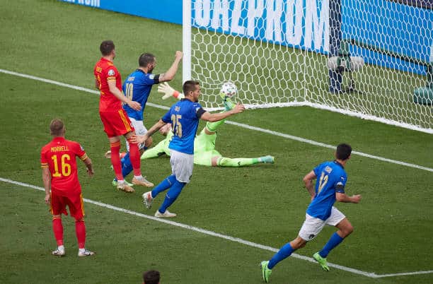 Italy maintain winning run as Wales make it into last-16
