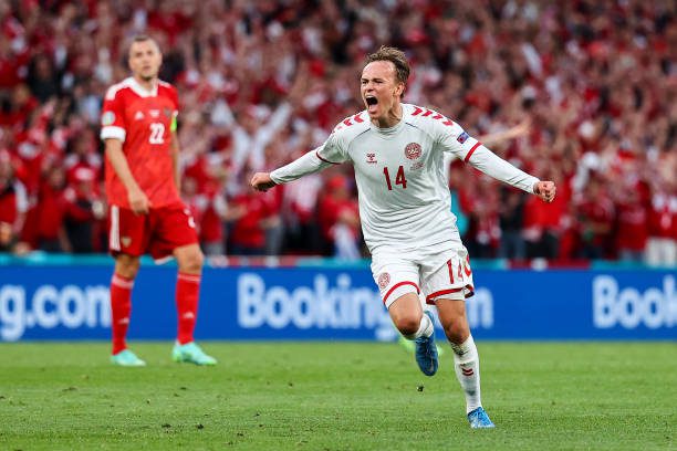 COPENHAGEN, DENMARK - JUNE 21: Mikkel Damsgaard of Denmark celebrates after scoring their side's first goal during the UEFA Euro 2020 Championship Group B match between Russia and Denmark at Parken Stadium on June 21, 2021 in Copenhagen, Denmark. (Photo by Wolfgang Rattay - Pool/Getty Images)