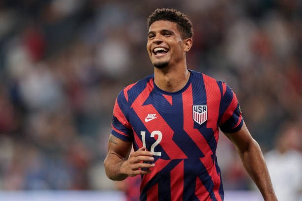 KANSAS CITY, KS - JULY 15: Miles Robinson #12 of the United States scores and celebrates during a game between Martinique and USMNT at Children's Mercy Park on July 15, 2021 in Kansas City, Kansas. Could Miles start in World Cup qualifying? (Photo by John Dorton/ISI Photos/Getty Images)
