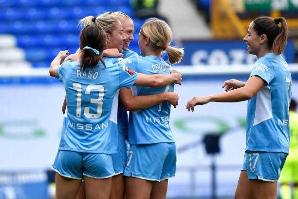 LIVERPOOL, ENGLAND - SEPTEMBER 04:   Janine Beckie of Manchester City celebrates scoring a goal to make the score 0-2 with her team-mates during the Barclays FA WSL match between Everton Women and Manchester City Women at Goodison Park on September 4, 2021 in Liverpool, United Kingdom. (Photo by Manchester City FC/Manchester City FC via Getty Images)
