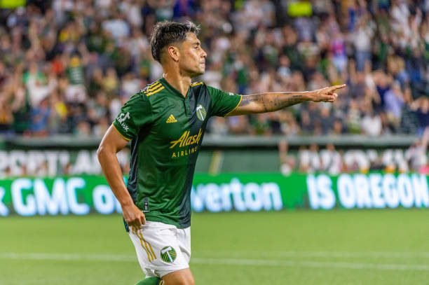 PORTLAND, OR - AUGUST 07:  Portland Timbers forward Felipe Mora (9) points at his assister, midfielder Sebastián Blanco, to celebrate Portland's third goal during the MLS match between Real Salt Lake and the Portland Timbers on August 07, 2021, at Providence Park in Portland, OR. (Photo by Diego Diaz/Icon Sportswire via Getty Images)