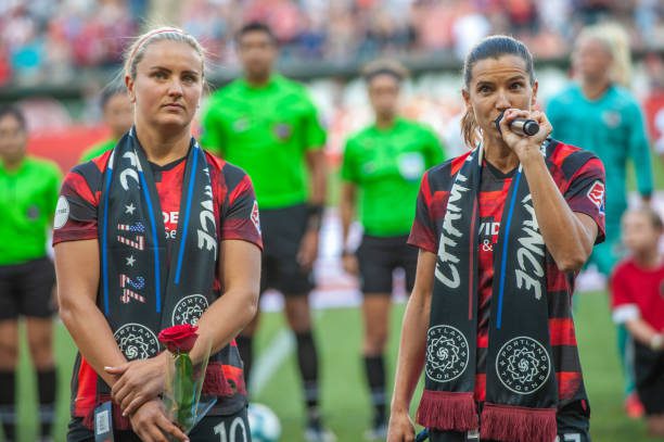 PORTLAND, OR - JULY 24: Portland Thorns midfielders Lindsey Horan and Tobin Heath are honored as part of the USNWT World Cup winner moments before the Portland Thorns 5-0 rout over the Houston Dash at Providence Park on July 24, 2019, in Portland, OR (Photo by Diego Diaz/Icon Sportswire via Getty Images).