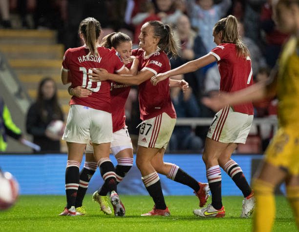 LEIGH, ENGLAND - SEPTEMBER 03: Ona Batlle of Manchester United celebrates scoring with team mates Kirsty Hanson, Lucy Staniforth and Ella Toone during the Barclays FA Women's Super League (WSL) match between Manchester United Women and Reading Women at Leigh Sports Village on September 3, 2021 in Leigh, United Kingdom. (Photo by Visionhaus/Getty Images)