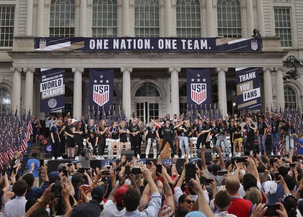 NEW YORK, NEW YORK - JULY 10: Members of the United States Women's National Soccer Team are honored at a ceremony at City Hall on July 10, 2019 in New York City. The honor followed a ticker tape parade up lower Manhattan's "Canyon of Heroes" to celebrate their gold medal victory in the 2019 Women's World Cup in France. Including Tobin Heath and Megan Rapinoe (Photo by Bruce Bennett/Getty Images)