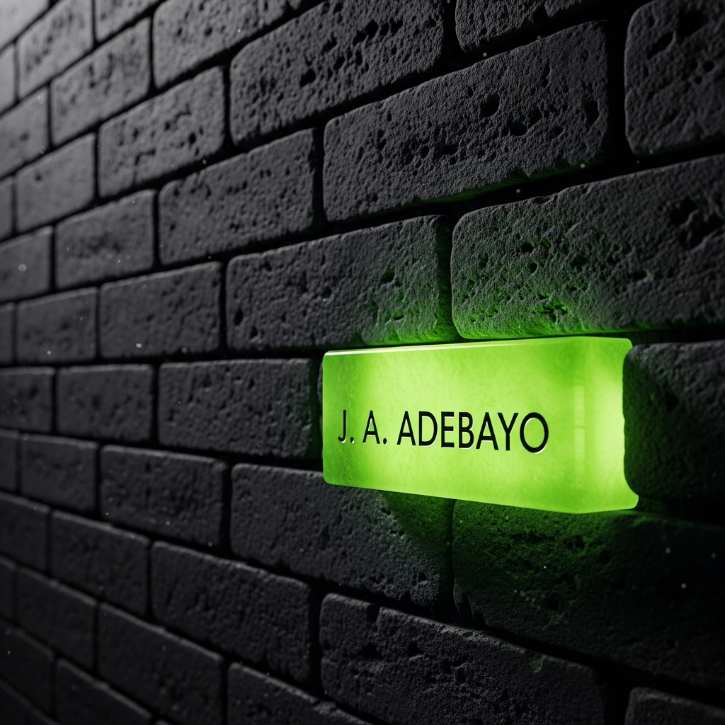 Thumbnail image showing a glowing lime green brick engraved with J. A. ADEBAYO